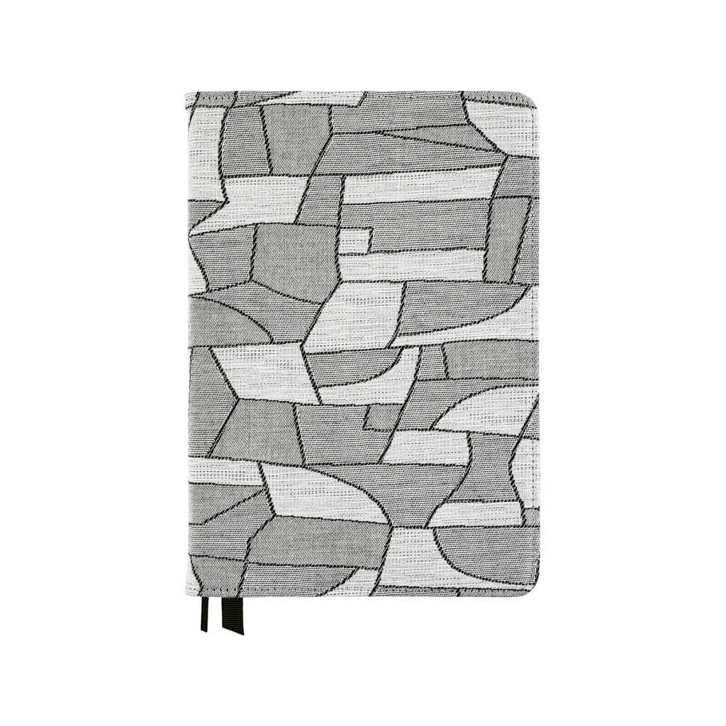 Geometric black and white design on fabric cover for Hobonichi Techo Cousin A5 planner on white background