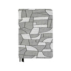 Geometric black and white design on fabric cover for Hobonichi Techo Cousin A5 planner on white background