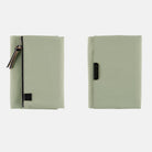 Oakmoss green zippered Tragen cover for Hobonichi Techo A6 planner on white background