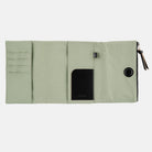 Oakmoss green zippered Tragen cover for Hobonichi Techo A6 planner on white background