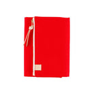 Red zippered Tragen cover for Hobonichi Techo A6 planner on white background
