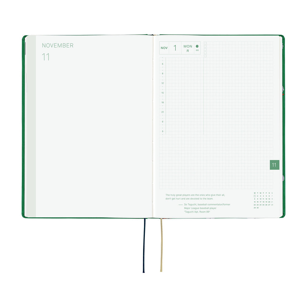 An open 2027 Hobonichi Techo HON hardcover planner showing the November start page beside a daily grid page, with two ribbon bookmarks hanging below on a white background.