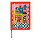 A red 2027 Hobonichi Techo HON hardcover planner featuring Yumi Kitagishi’s colorful dollhouse illustration with cats, rabbits, flowers, and other playful details on a white background.