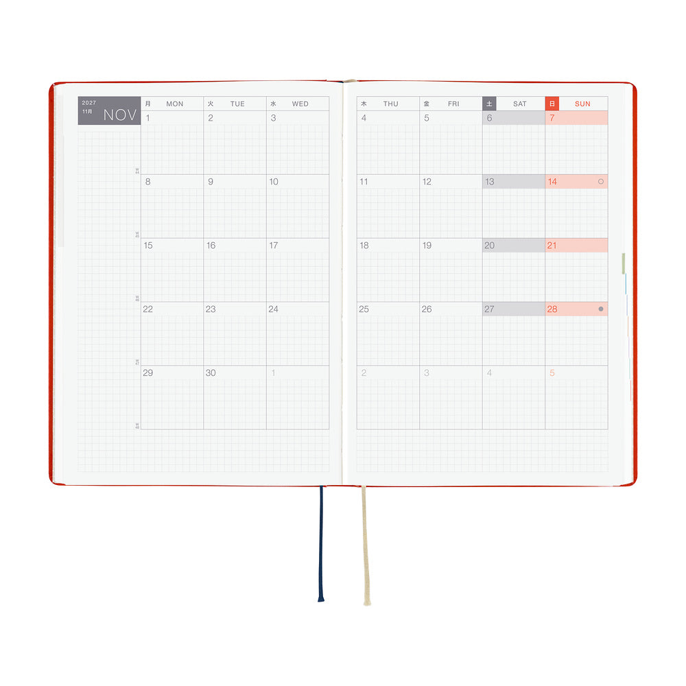 An open 2027 Hobonichi Techo HON hardcover planner showing a two-page monthly calendar layout for November, with two ribbon bookmarks hanging below on a white background.
