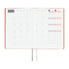 An open 2027 Hobonichi Techo HON hardcover planner showing a two-page monthly calendar layout for November, with two ribbon bookmarks hanging below on a white background.
