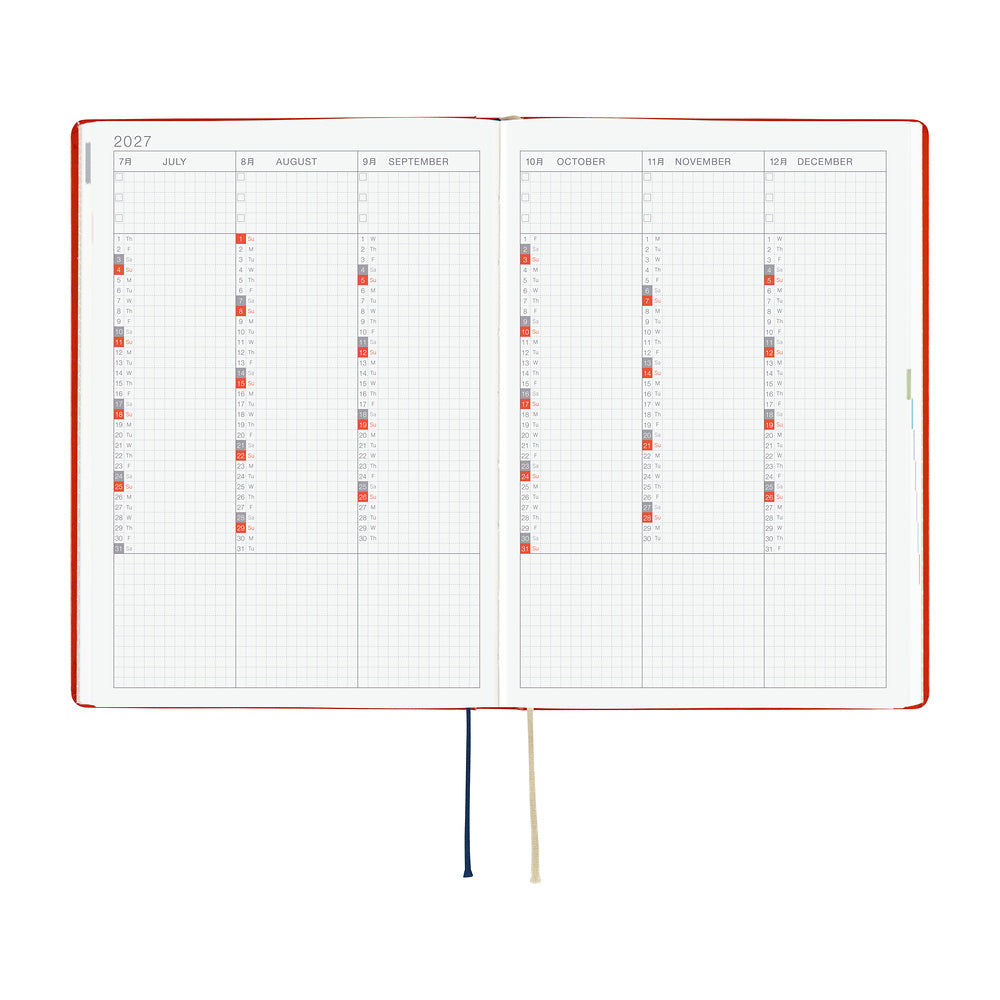 An open 2027 Hobonichi Techo HON hardcover planner showing a six-month overview from July through December, with two ribbon bookmarks on a white background.