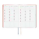 An open 2027 Hobonichi Techo HON hardcover planner showing a six-month overview from July through December, with two ribbon bookmarks on a white background.