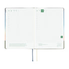 An open 2027 Hobonichi Techo HON hardcover planner showing two daily grid pages for November 6 and 7, with timelines, checkboxes, quotes, and two ribbon bookmarks on a white background.