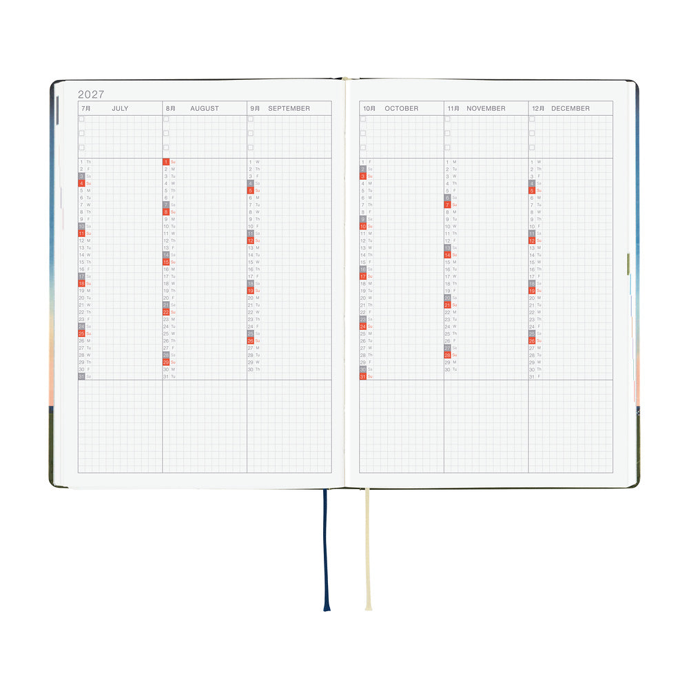 An open 2027 Hobonichi Techo HON hardcover planner showing a six-month overview from July through December, with two ribbon bookmarks on a white background.