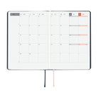 An open 2027 Hobonichi Techo HON hardcover planner showing a two-page monthly calendar layout for November, with two ribbon bookmarks hanging below on a white background.
