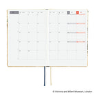An open 2027 Hobonichi Techo HON hardcover planner showing a two-page monthly calendar layout for November, with two ribbon bookmarks hanging below on a white background.