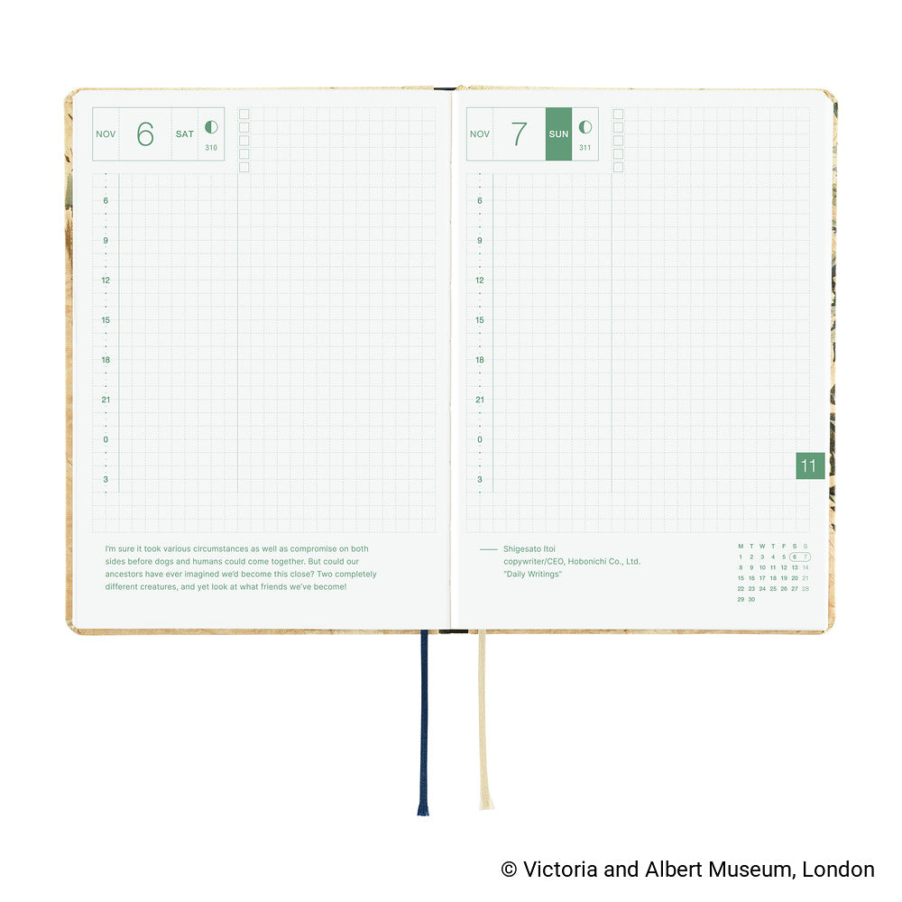 An open 2027 Hobonichi Techo HON hardcover planner showing two daily grid pages for November 6 and 7, with timelines, checkboxes, quotes, and two ribbon bookmarks on a white background.