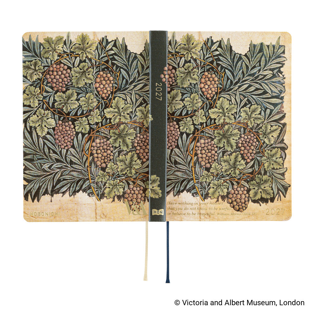 The 2027 Hobonichi Techo HON hardcover laid flat to show the Vine botanical design wrapping across the front and back covers and spine, with two ribbon bookmarks on a white background.