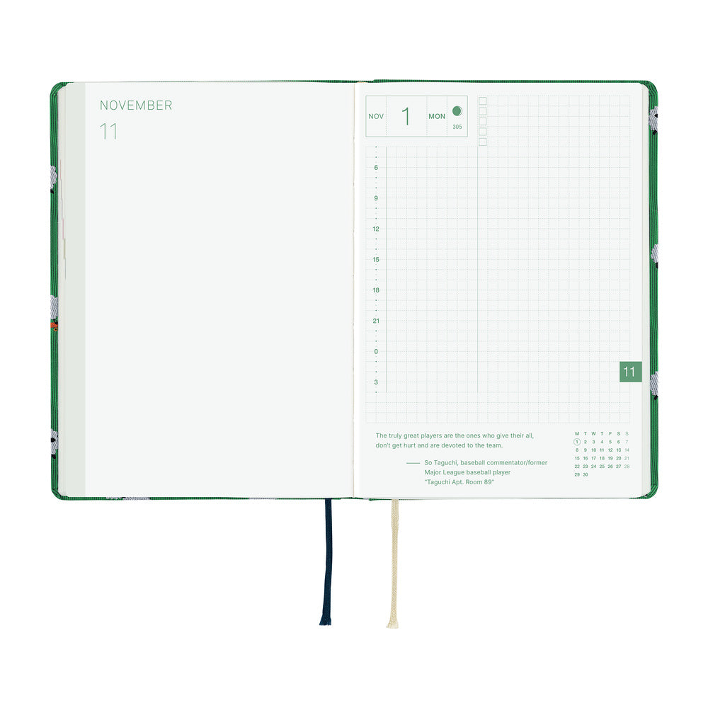 A 2027 Hobonichi HON covered in Bow & Tie fabric woven with a sheep design on a green background
