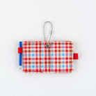 Open small plaid notebook keychain with a silver ball chain and a red loop holding a blue pencil shown on a plain white background.