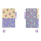 Front and back of Hobonichi Techo A6 Original Unsodo Book in ivory and purple floral cover with purple pen loops on white background