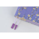Close up of purple page keeper bookmarks of Hobonichi A6 cover