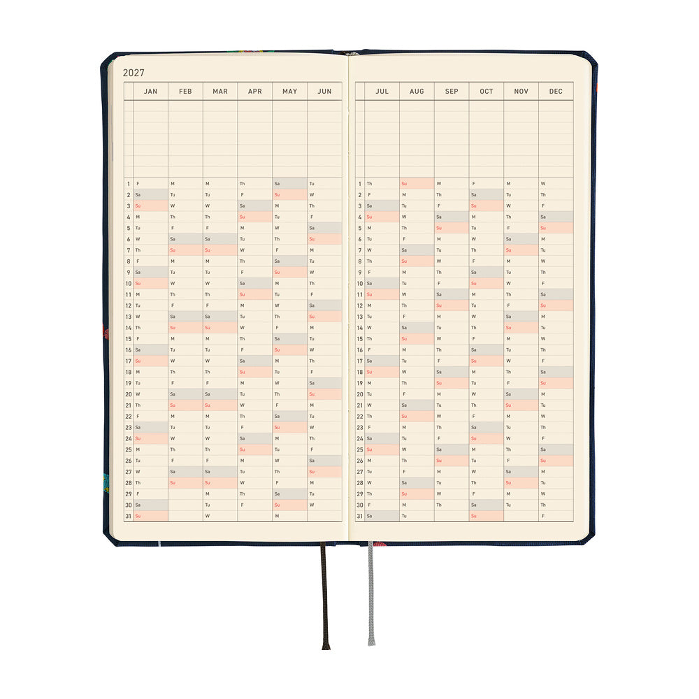An open 2027 planner with cream-colored interior pages featuring a yearly calendar grid.