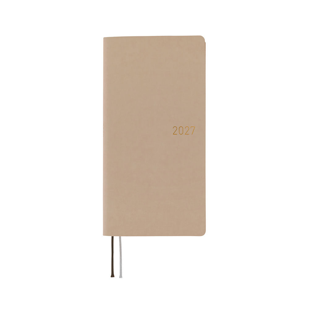 A planner with a sandy beige softcover that is flexible and slightly puffy. The year 2027 is embossed in gold on the front. 