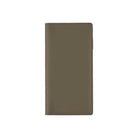 Front of warm gray leather Hobonichi Weeks cover on white background