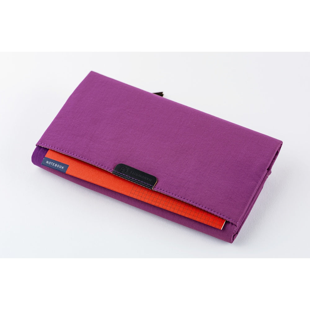 A Hobonichi Weeks Tragen cover in the color Purple.