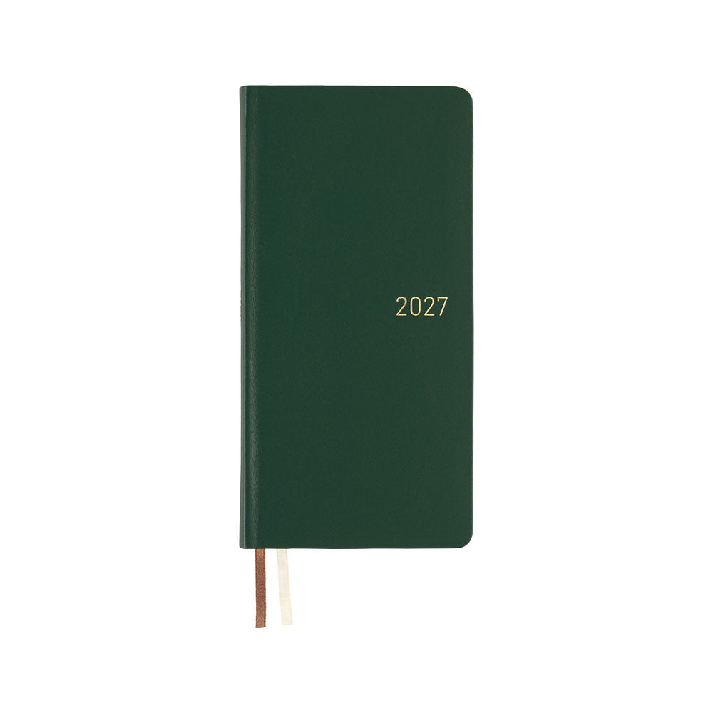 A dark green leather covered planner  with the year '2027' printed in gold on the front cover, shown closed on a plain white background with two ribbon bookmarks visible.