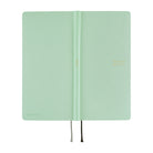 The exterior of a frosty green 2027 planner, shown closed with thin ribbon bookmarks hanging from the bottom edge, set against a plain white background.
