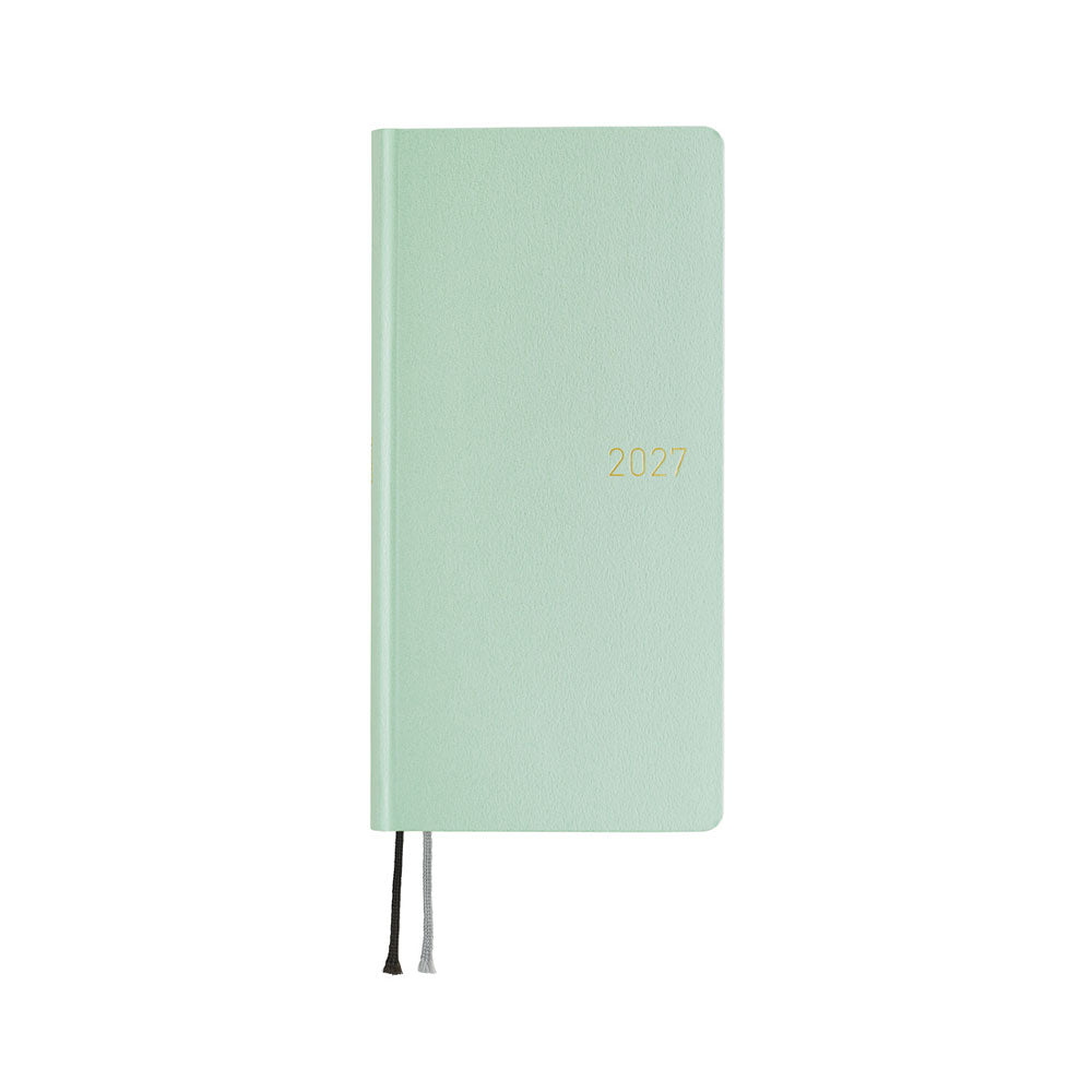 A frosty green 2027 planner, shown closed with thin ribbon bookmarks hanging from the bottom edge, set against a plain white background.