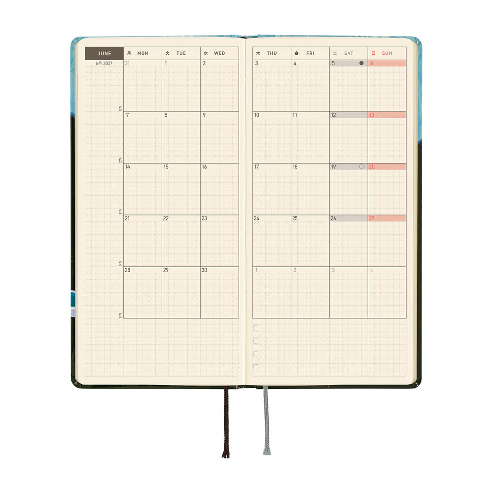 An open monthly planner with grid pages showing a calendar layouts for June, photographed on a plain white background.