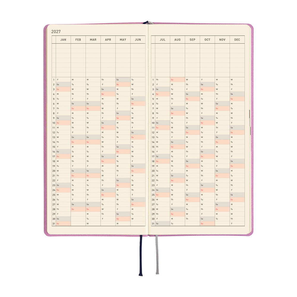 An open monthly planner or calendar with cream-colored pages and a vertical grid layout showing dates from January to December. Black and gray ribbon bookmarks hang from the bottom center.