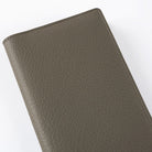 Front of warm gray leather Hobonichi Weeks cover on white background