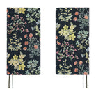 Front and back views of a 2027 planner covered in fabric featuring a botanical design on a dark background by Liberty Fabrics. 