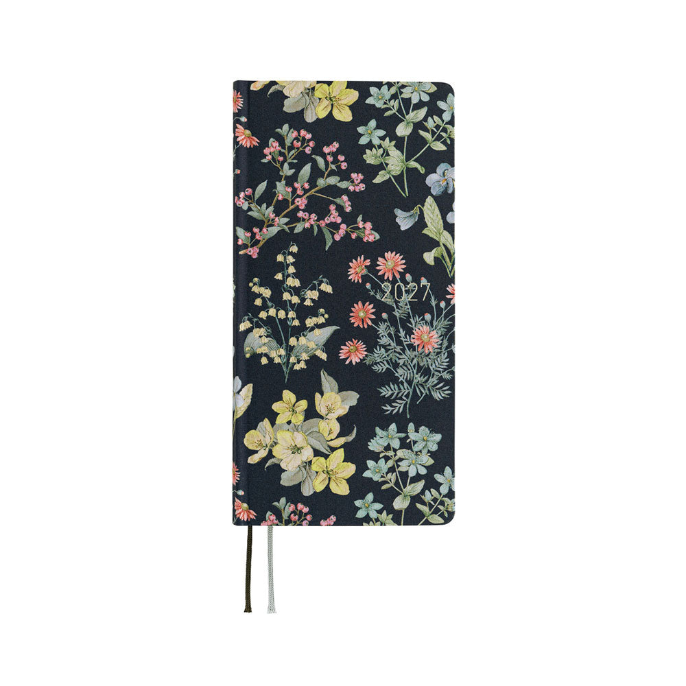 A 2027 planner covered in fabric featuring a botanical design on a dark background by Liberty Fabrics. 