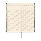 An open 2027 daily planner with cream-colored pages showing a yearly calendar grid over a two-page spread.