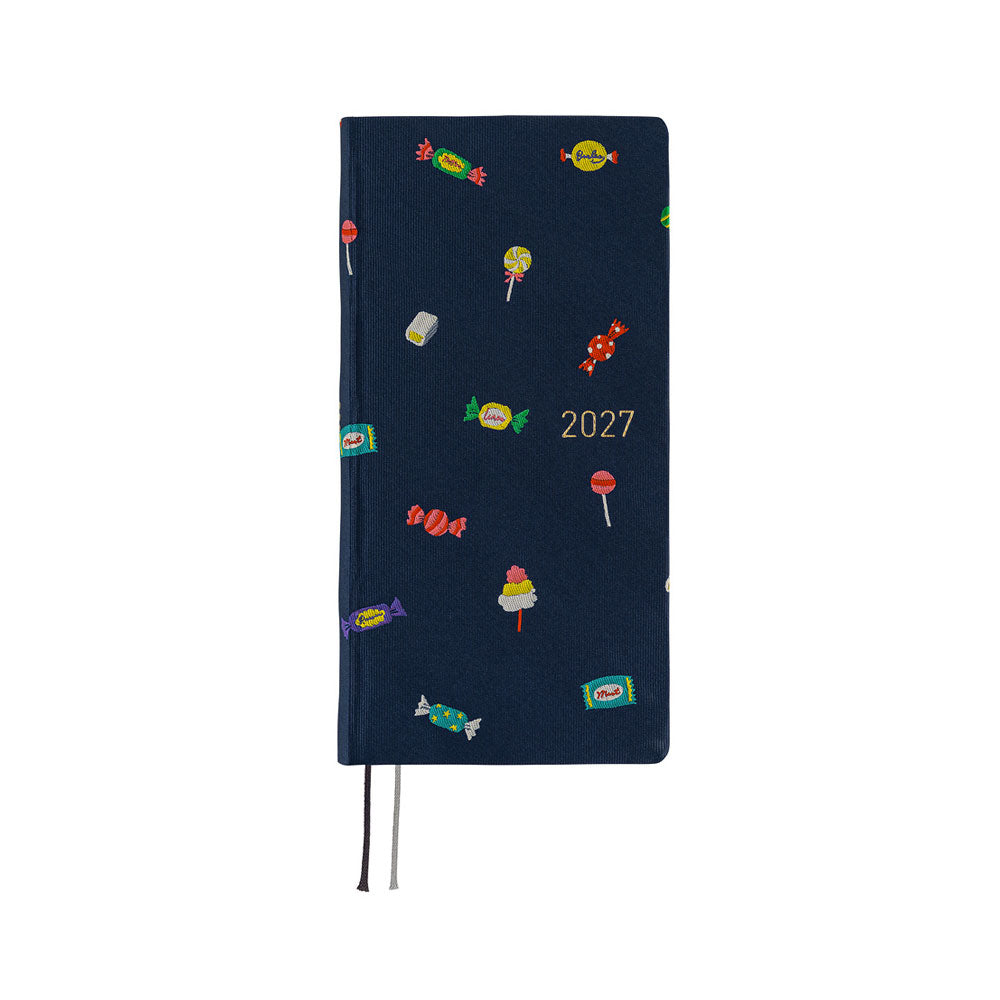 A 2027 Hobonichi Weeks Mega featuring Bow & Tie fabric woven with candy designs.
