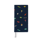 A 2027 Hobonichi Weeks Mega featuring Bow & Tie fabric woven with candy designs.