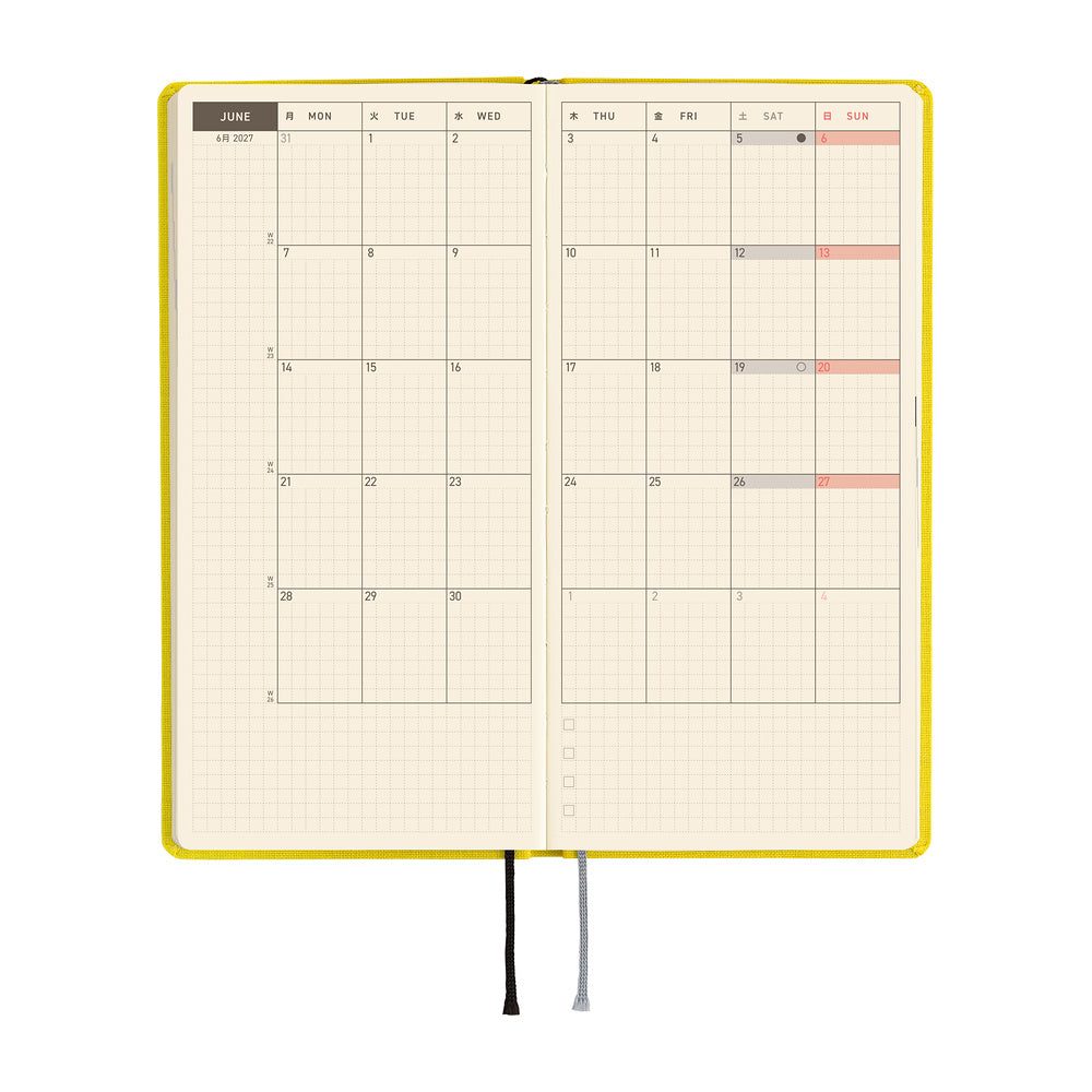A planner open to a two-page monthly spread showing the month of June.