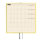 A planner open to a two-page monthly spread showing the month of June.