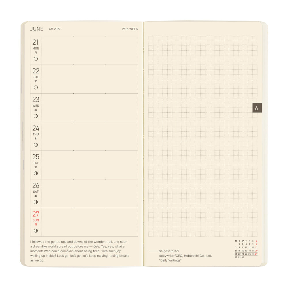 An open cream-colored daily planner showing a weekly layout on the left page and a blank grid section on the right page, photographed against a plain white background.