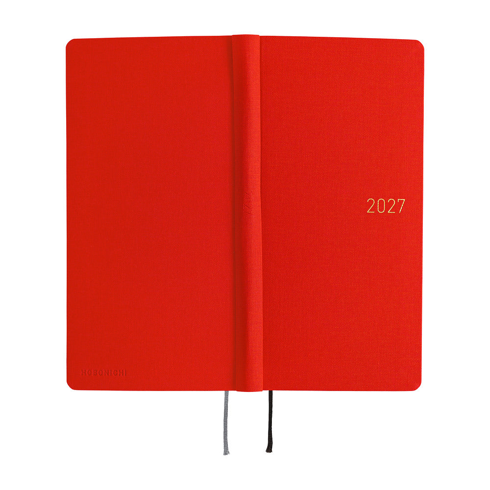 A 2027 Hobonichi Mega Weeks planner in the color Poppy Red