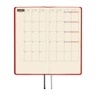 A 2027 Hobonichi Mega Weeks planner in the color Poppy Red