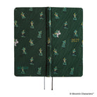 The exterior of a dark green planner covered with woven "bow & tie" fabric featuring Moomin characters and the year '2027' in gold foil.
