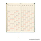 An open 2027 daily planner with cream-colored pages featuring a yearly grid calendar layout and two black ribbon bookmarks.