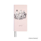 A light pink 2027 planner featuring Moomin characters dining at a table on the cover. 