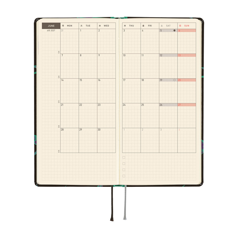 An open planner showing a two-page monthly calendar spread on cream grid pages.