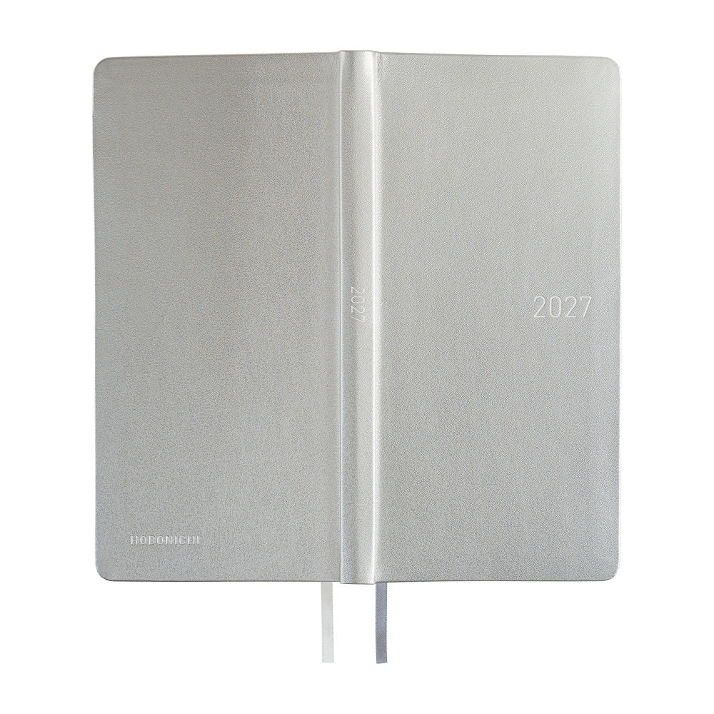 The exterior of a slim planner covered in silver leather. 2027 is embossed in silver on the front cover and spine. 