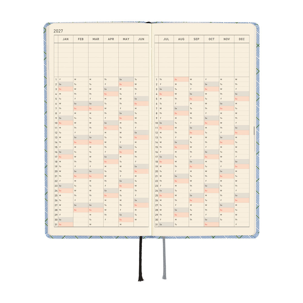 An open planner or calendar showing a 2027 yearly layout with cream pages.