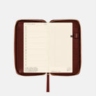 Burgundy deep red zippered case cover for Hobonichi Techo Weeks on white background
