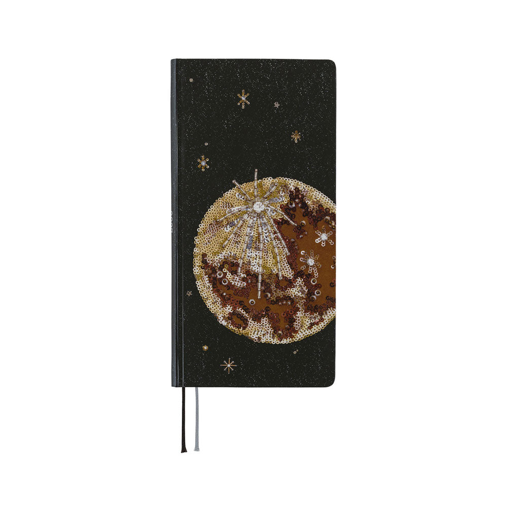 The front cover of a planner featuring a printed image of an embroidery piece crafted from countless beads, sequins, and jewels depicting the luminous moon surrounded by shining stars in the night sky.