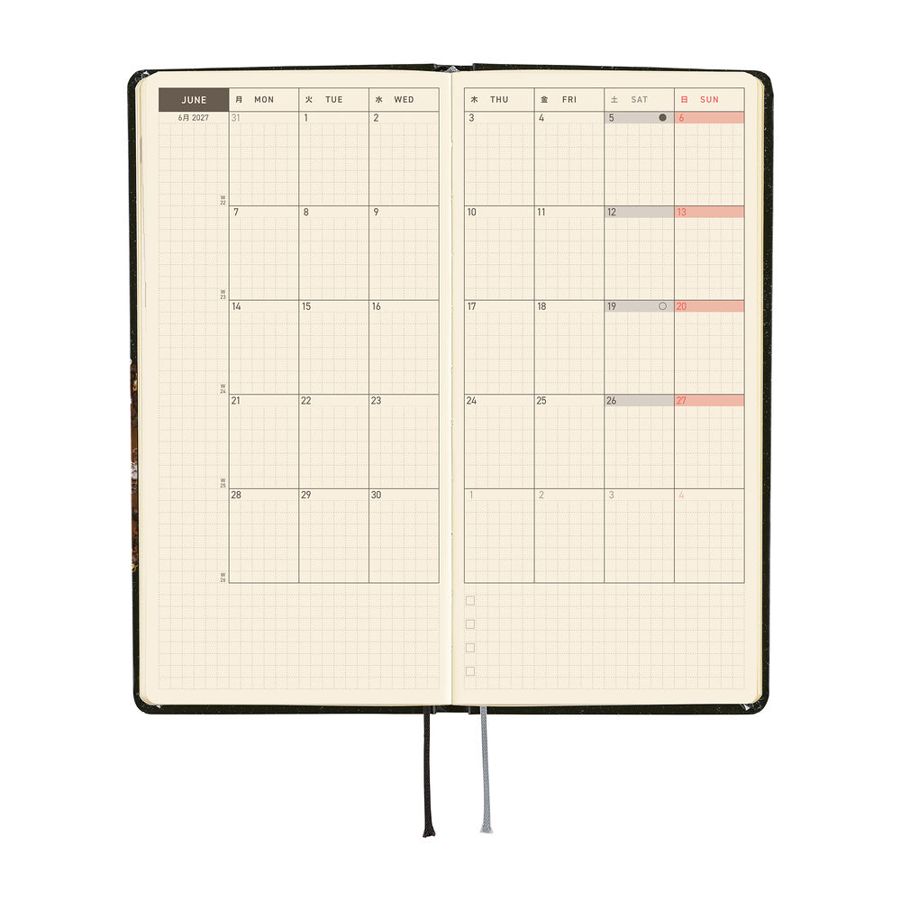 An open monthly planner with a two-page monthly calendar spread. 